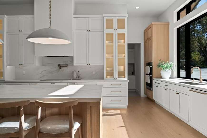 Modern White Kitchen With Island And Large Window PQVP5QmskxM